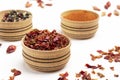 Dry spices, ground pepper and allspice in wooden bowls. Pepper petals on table Royalty Free Stock Photo