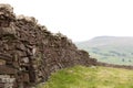 Dry stacked stone wall with the hills of the  Yorkshire Dales Royalty Free Stock Photo