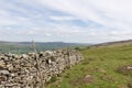 Dry stacked stone wall with the hills of the Yorkshire Dales Royalty Free Stock Photo