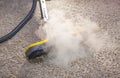 Dry steam cleaner in action. Royalty Free Stock Photo