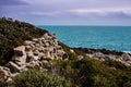 Dry stone structures over a mountain and blue sea