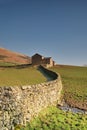 Dry stone wall and barn Royalty Free Stock Photo