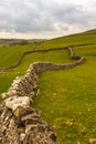 Dry stone walls snake their way into the distant fields on the Yorkshire Moors near Malham, North Yorkshire Royalty Free Stock Photo