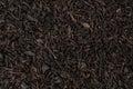 Dry tea leaves background or texture, black tea pattern Royalty Free Stock Photo