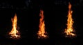 Set of three photo of an orange bonfire close-up isolated on a black background in a night forest Royalty Free Stock Photo