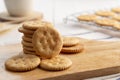 Dry thin circle crispy crackers on cutting board Royalty Free Stock Photo