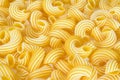 Dry uncooked cavatappi italian pasta full background. Royalty Free Stock Photo