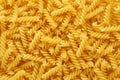 Dry uncooked fusilli pasta as a background Royalty Free Stock Photo