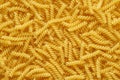 Dry uncooked girandole pasta as a background Royalty Free Stock Photo