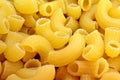 Dry uncooked macaroni pasta background Royalty Free Stock Photo