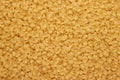 Dry uncooked macaroni texture background