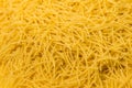 Dry vermicelli pasta ready for cooking. close up with copy space. Food photo Royalty Free Stock Photo