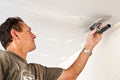 Dry waller working at the ceiling Royalty Free Stock Photo