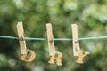 DRY word written by hanged wooden letters on rope at garden