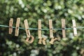 DRY word written by hanged wooden letters on rope at garden