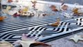 Dry yellow autumn fallen maple leaves, metal grate on ground of american street. Royalty Free Stock Photo