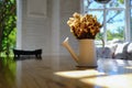 Dry yellow flower bouquet in the metal vase on wood table in the Royalty Free Stock Photo