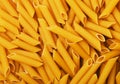 Dry yellow penne pasta Royalty Free Stock Photo