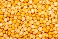 Dry yellow split peas background. Halves of yellow legume peas. Royalty Free Stock Photo