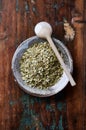 Dry yerba mate leaves on wooden background. Royalty Free Stock Photo