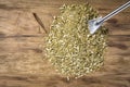 Dry yerba mate leaves on wooden table Royalty Free Stock Photo