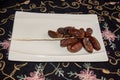 Dryed Dates. Dates on a white plate.