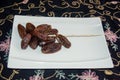 Dryed Dates. Dates on a white plate.