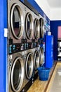 Dryer machine and washing machine in self service laundry station Royalty Free Stock Photo