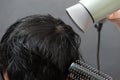 Drying black hair after dying. Royalty Free Stock Photo