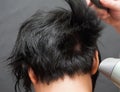 Drying black hair after dying Royalty Free Stock Photo