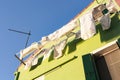 Drying clothes under the sun in the fishermen village of Burano island, Venice, Italy Royalty Free Stock Photo