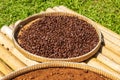 Drying coffee beans in bamboo tray Royalty Free Stock Photo