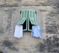 Drying freshly washed laundry outside the window.