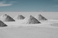 Drying Hand-shoveled Salt Piles on Bolivia`s Salar de Uyuni Royalty Free Stock Photo