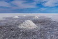 Drying hand- shoveled salt piles at Salar de Uyuni, Bolivia Royalty Free Stock Photo