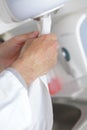 Drying hands with towel after washing