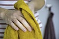 Drying hands with a towel after washing them in the kitchen Royalty Free Stock Photo