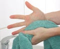 Drying hands using a towel Royalty Free Stock Photo