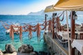 Drying octopus arms at Greek tavern on Santorini island, traditional greek seafood prepared on a grill Royalty Free Stock Photo