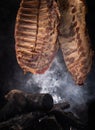 Drying pork meat in smokehouse Royalty Free Stock Photo