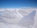 Drying salt piles on the Salar de Uyuni Royalty Free Stock Photo