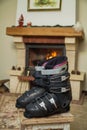 Boots ski boots in front of fireplace Royalty Free Stock Photo