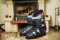 Boots ski boots in front of fireplace Royalty Free Stock Photo