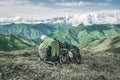 Drying towel and shoes on backpack on a background of mountains Royalty Free Stock Photo