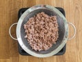 Drying the tuna fish in a colander Royalty Free Stock Photo