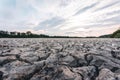 Dry lake in Bavaria Germany. Drought and climate change, landscape of cracked earth after lake has dried up in summer. Water