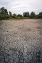 Dry lake in Bavaria Germany. Drought and climate change, landscape of cracked earth after lake has dried up in summer. Water Royalty Free Stock Photo