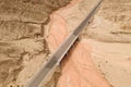 Dryness land with erosion terrain with highway crossing Royalty Free Stock Photo