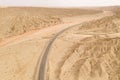 Dryness land with erosion terrain with highway crossing Royalty Free Stock Photo