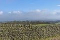 A drystone Wall on Ilkley Moor in West Yorkshire on a fine day in July. Royalty Free Stock Photo